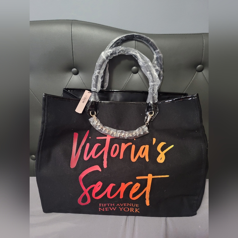 Weekender Victoria Secret,  black with colorful signs.